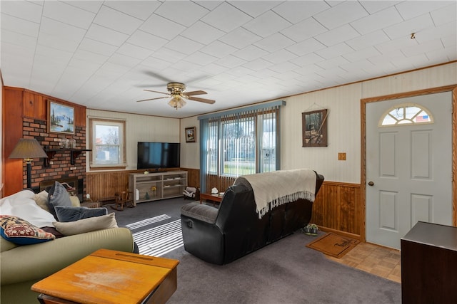 living room with parquet floors, ceiling fan, and wood walls