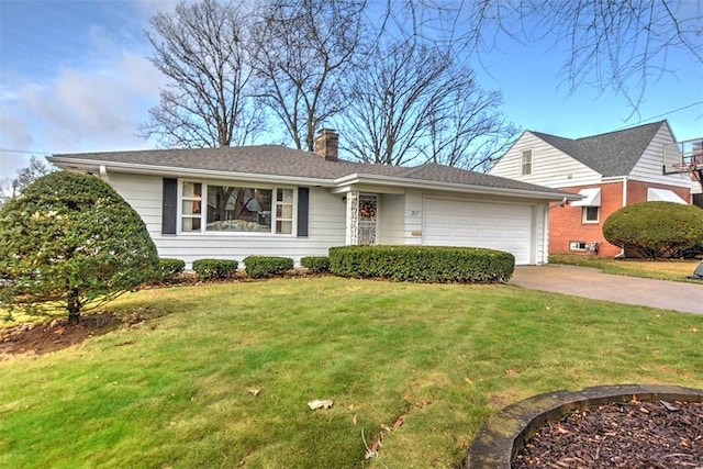 view of front facade with a front yard and a garage