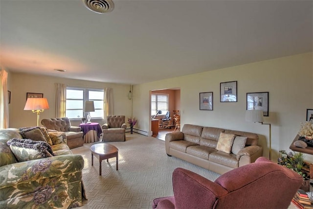 carpeted living room with a baseboard heating unit