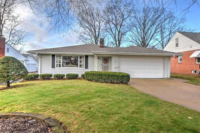 ranch-style home featuring a garage and a front lawn