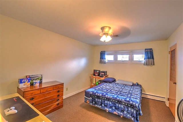 bedroom with dark carpet, baseboard heating, and ceiling fan