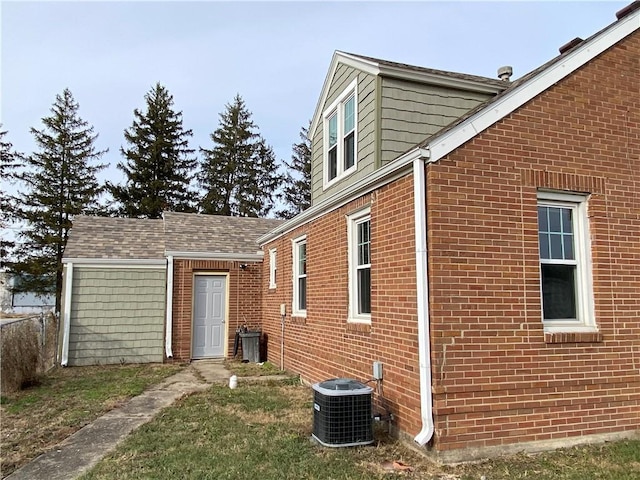 view of side of property with cooling unit