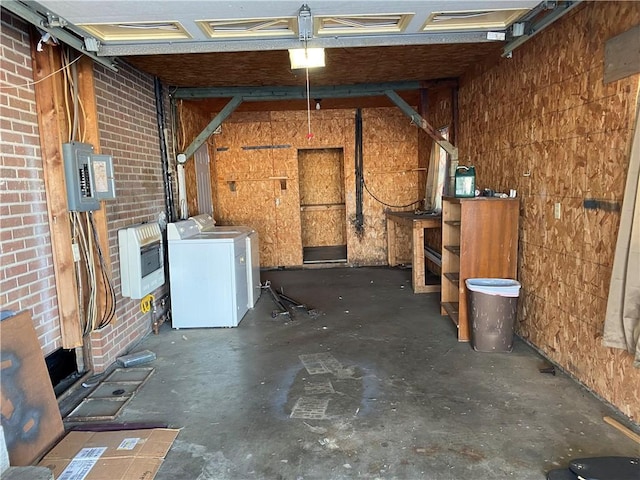 interior space featuring electric panel, independent washer and dryer, and heating unit