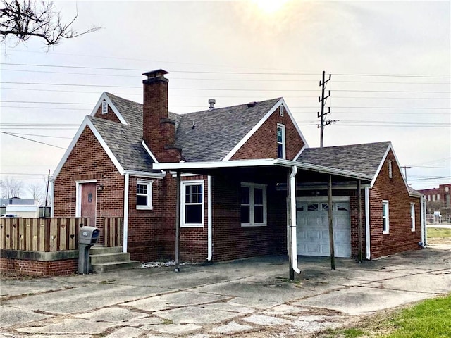 back of property with a garage