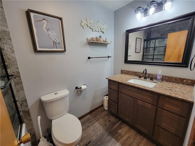 505 W N 9th St, Shelbyville, IL 62565 - bathroom featuring wood finished floors, vanity, and tiled shower