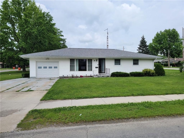 505 W N 9th St, Shelbyville, IL 62565 - ranch-style house featuring an attached garage, concrete driveway, and a front yard