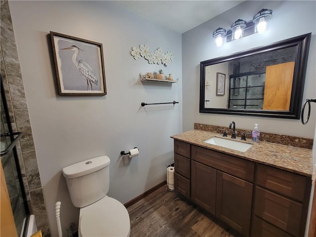 505 W N 9th St, Shelbyville, IL 62565 - bathroom featuring wood finished floors, vanity, and tiled shower