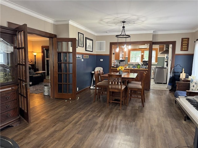 1007 10th St, Charleston, IL 61920 - dining area with dark wood-type flooring and crown molding