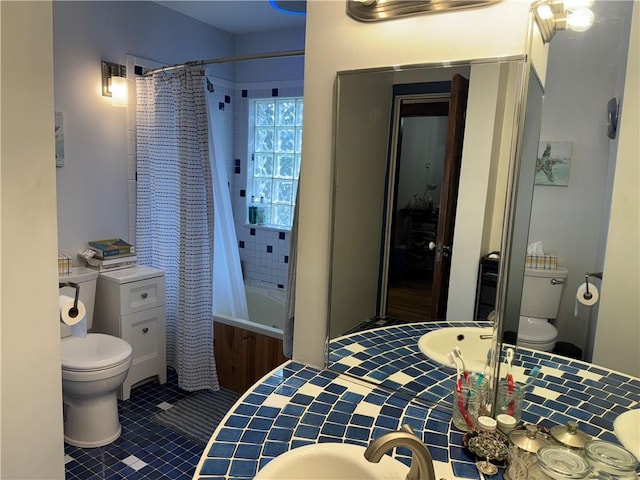 1007 10th St, Charleston, IL 61920 - full bath with toilet, shower / bath combo, tile patterned floors, and a sink