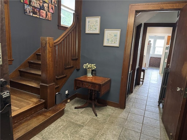 1007 10th St, Charleston, IL 61920 - stairs with baseboards and tile patterned floors