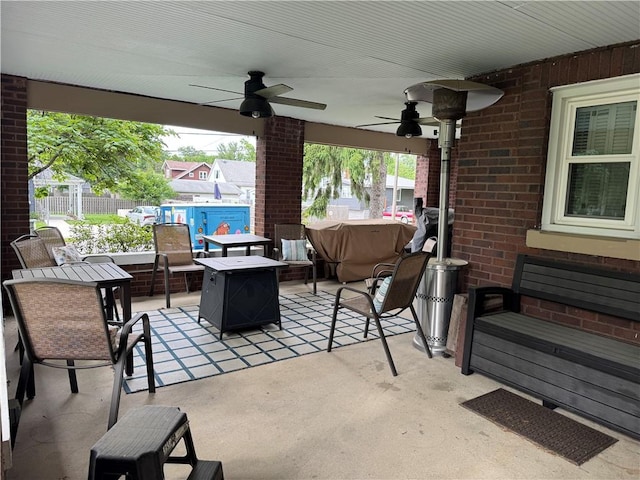 1007 10th St, Charleston, IL 61920 - view of patio featuring ceiling fan and an outdoor fire pit
