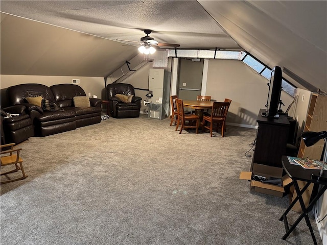 1007 10th St, Charleston, IL 61920 - living room with ceiling fan, carpet floors, lofted ceiling, and a textured ceiling