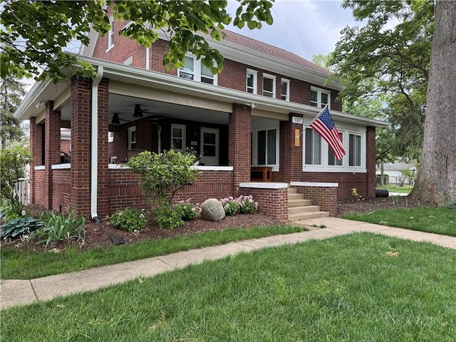 1007 10th St, Charleston, IL 61920 - traditional style home with brick siding, a porch, and a front lawn