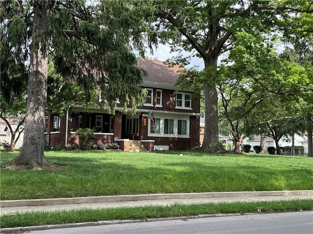 1007 10th St, Charleston, IL 61920 - view of front of home with brick siding and a front yard