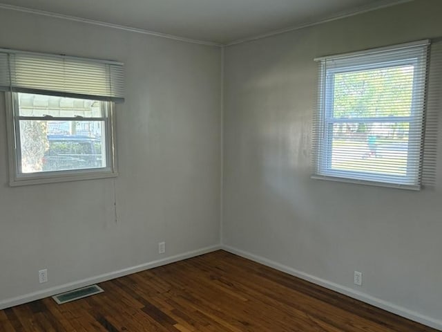 1216 Lawn Dr, Mattoon, IL 61938 - spare room with dark wood-type flooring and crown molding