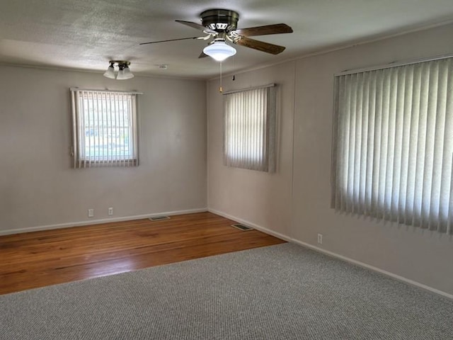 1216 Lawn Dr, Mattoon, IL 61938 - unfurnished room featuring a ceiling fan and wood finished floors