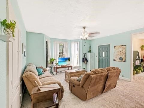 525 N 7th St, Charleston, IL 61920 - carpeted living room with a ceiling fan and baseboards