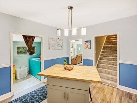 525 N 7th St, Charleston, IL 61920 - dining space featuring stairs and light wood-style floors