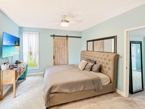 525 N 7th St, Charleston, IL 61920 - carpeted bedroom featuring a barn door and a ceiling fan
