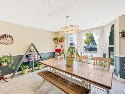 525 N 7th St, Charleston, IL 61920 - dining room featuring a textured ceiling and a chandelier