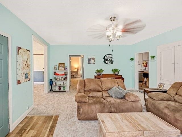 525 N 7th St, Charleston, IL 61920 - carpeted living area featuring a ceiling fan and baseboards