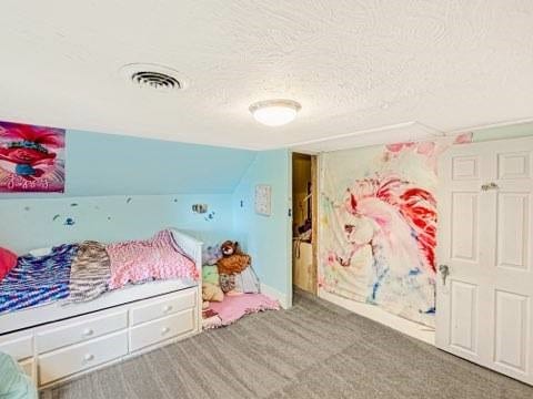 525 N 7th St, Charleston, IL 61920 - carpeted bedroom with a textured ceiling