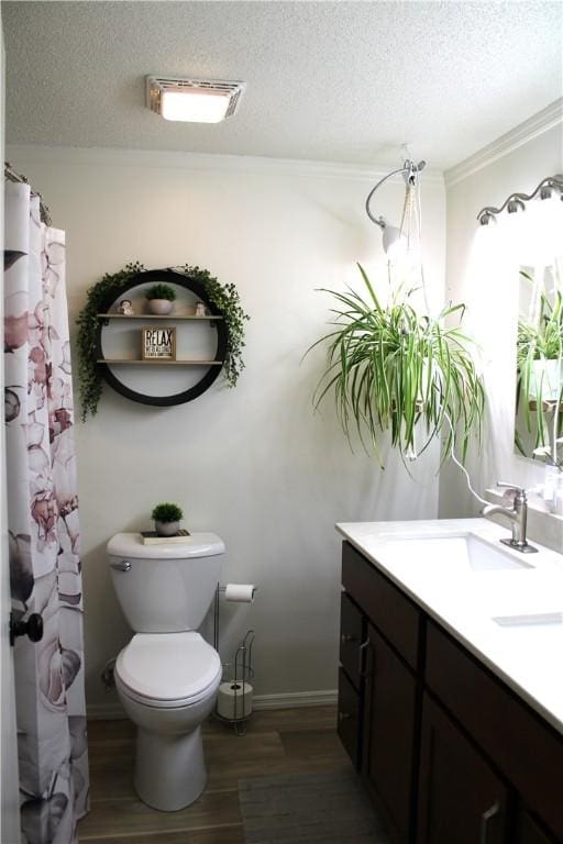 full bathroom with a textured ceiling, wood finished floors, vanity, and toilet