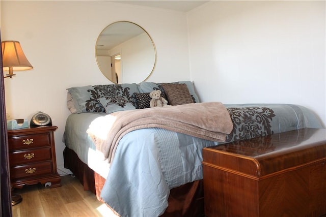 bedroom featuring wood finished floors