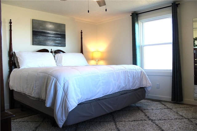 bedroom featuring baseboards and ornamental molding
