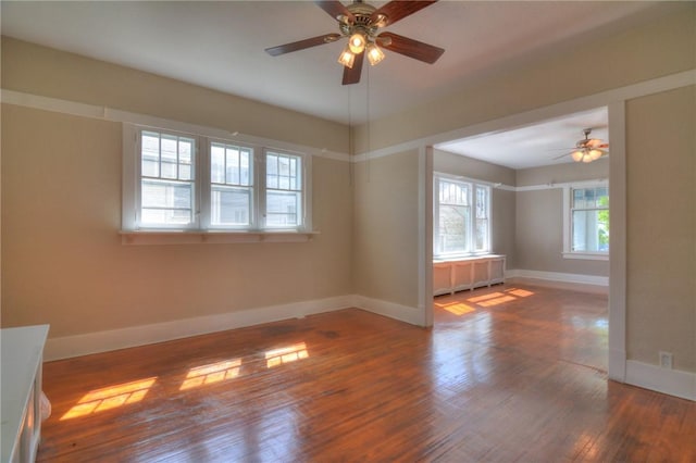 1416 W Decatur St, Decatur, IL 62522 - empty room with a ceiling fan, wood finished floors, and baseboards