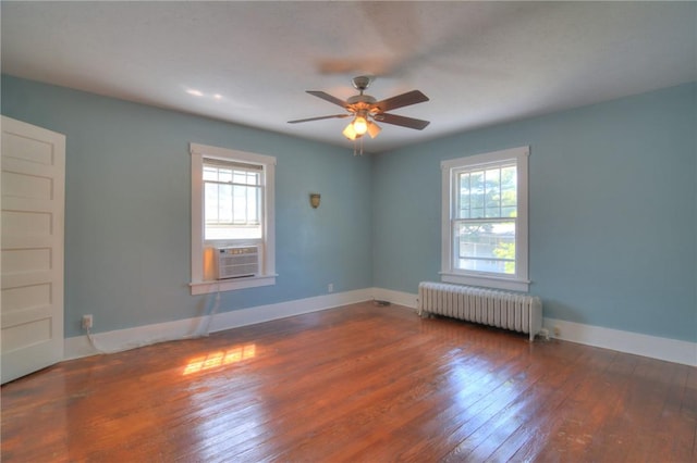 1416 W Decatur St, Decatur, IL 62522 - unfurnished room with radiator, cooling unit, hardwood / wood-style floors, ceiling fan, and baseboards