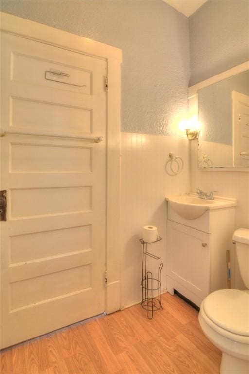 1416 W Decatur St, Decatur, IL 62522 - bathroom with toilet, wood finished floors, and vanity