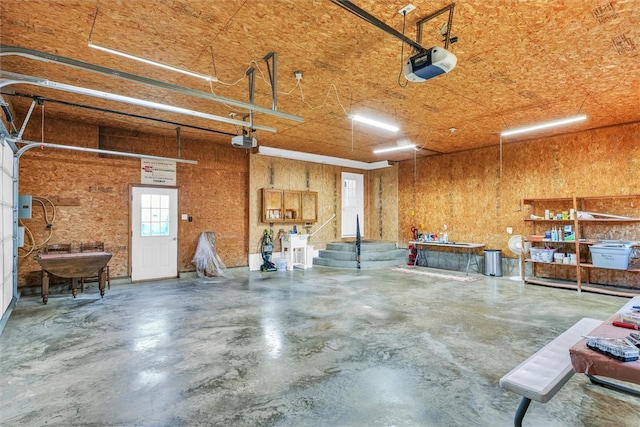 garage featuring sink and a garage door opener