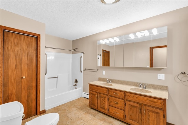 full bathroom with vanity,  shower combination, a baseboard heating unit, toilet, and a textured ceiling