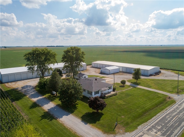 birds eye view of property with a rural view