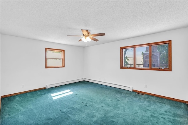 empty room with carpet flooring, a textured ceiling, a baseboard radiator, and ceiling fan