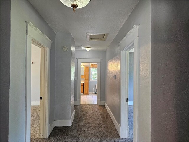 301 S Meridian St, Toledo, IL 62468 - corridor with carpet floors, attic access, a textured wall, and a textured ceiling