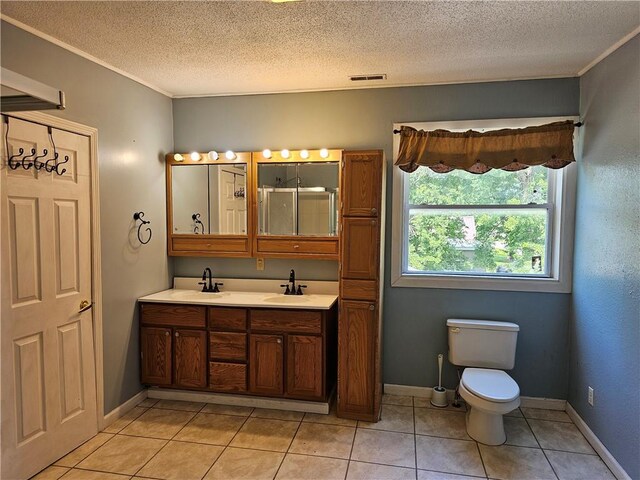 301 S Meridian St, Toledo, IL 62468 - full bath featuring double vanity, a textured ceiling, tile patterned flooring, a shower, and ornamental molding