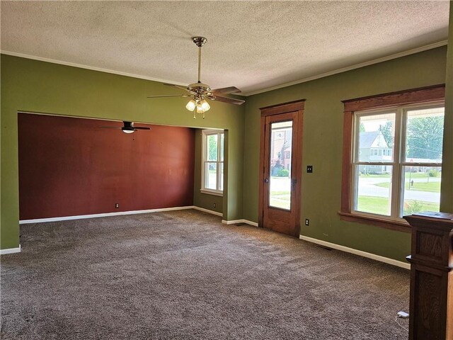 301 S Meridian St, Toledo, IL 62468 - carpeted spare room with a textured ceiling, a ceiling fan, and ornamental molding