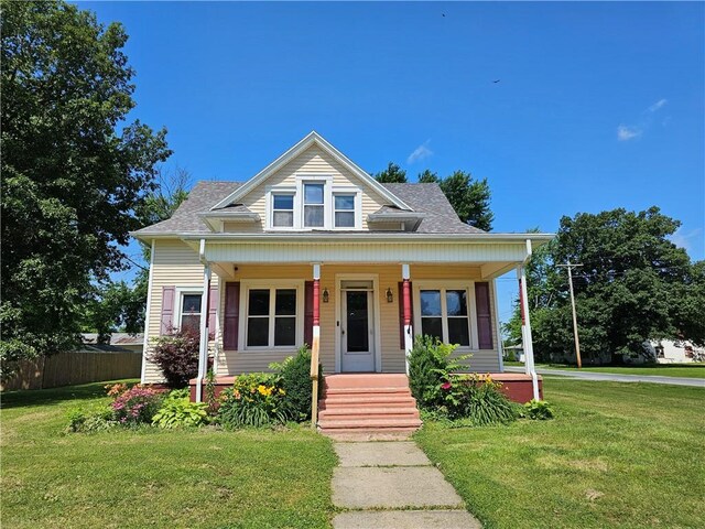 301 S Meridian St, Toledo, IL 62468 - bungalow-style home with a porch and roof with shingles