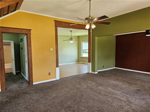 301 S Meridian St, Toledo, IL 62468 - empty room featuring a ceiling fan, carpet floors, crown molding, a textured ceiling, and lofted ceiling