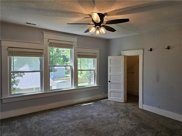 301 S Meridian St, Toledo, IL 62468 - carpeted empty room featuring ceiling fan and a textured ceiling