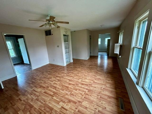 1010 N Summit Ave, Decatur, IL 62522 - unfurnished room with wood finished floors and a ceiling fan