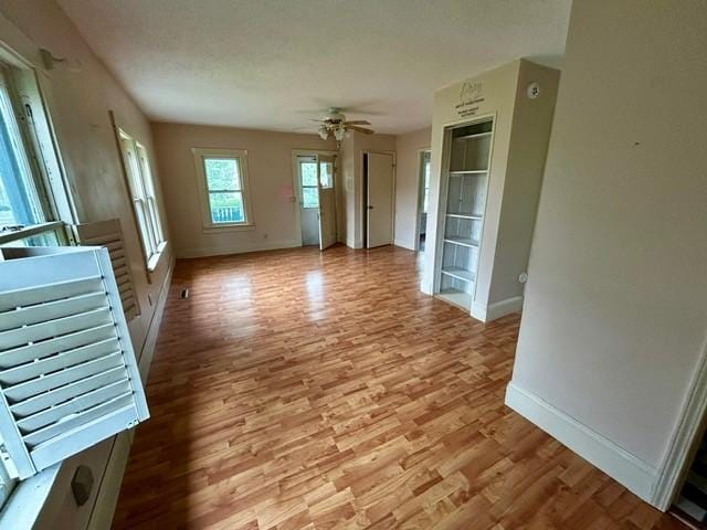 1010 N Summit Ave, Decatur, IL 62522 - unfurnished living room with wood finished floors and a ceiling fan