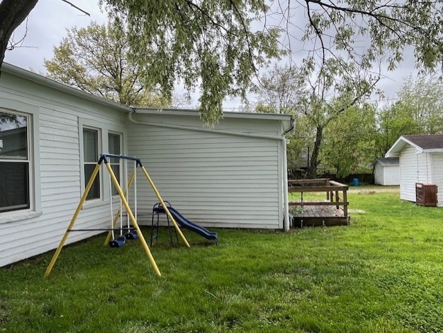 exterior space with entry steps and a yard