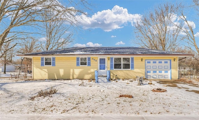 ranch-style house featuring an attached garage