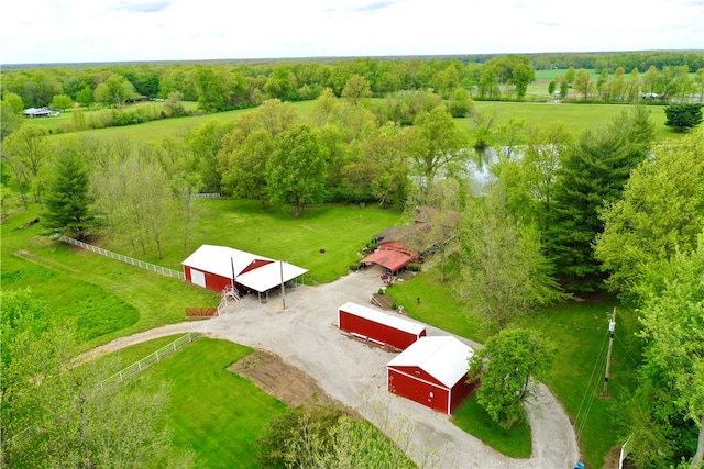 birds eye view of property with a water view and a rural view