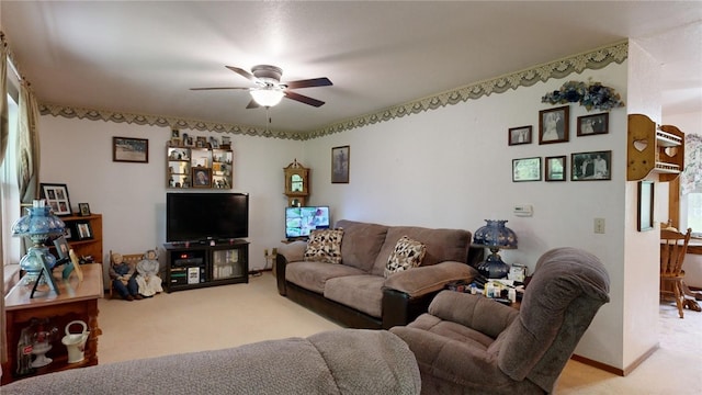 living room featuring ceiling fan and light colored carpet