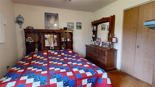 carpeted bedroom featuring a closet