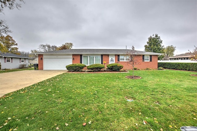 ranch-style house featuring a garage and a front lawn